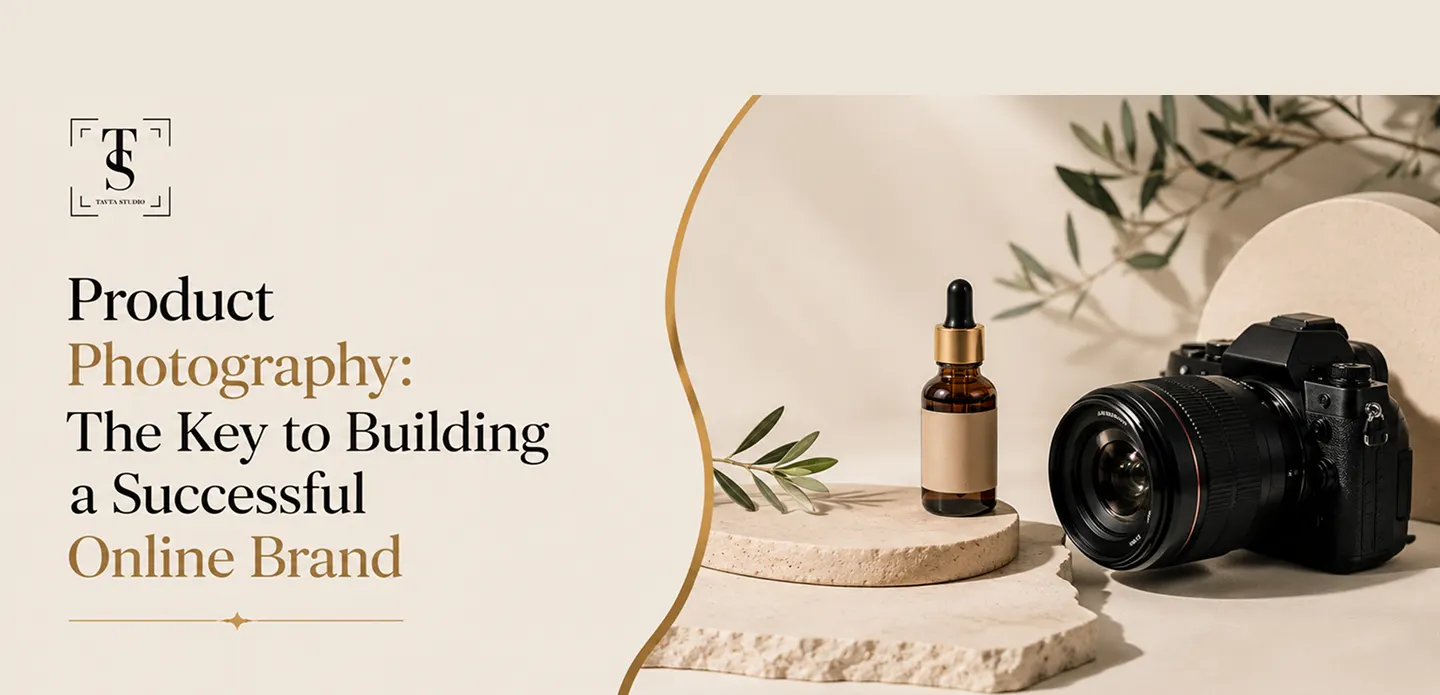 Product photography setup with a camera, amber dropper bottle, and decorative leaves on beige textured platforms.